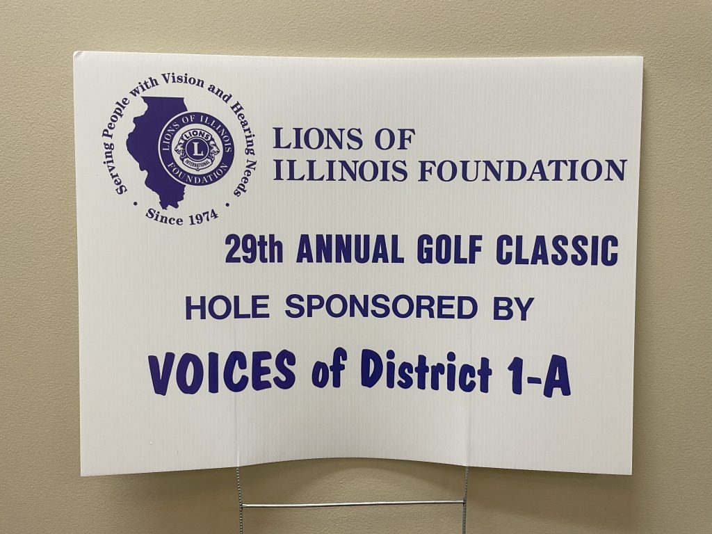 A sign promoting the Lions of Illinois Foundation Annual Golf Classic sponsorship organization.
